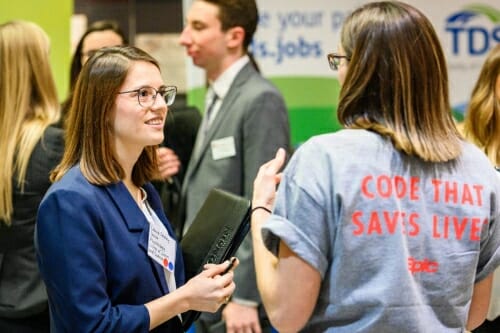 Photo: A student talks to a recruiter.