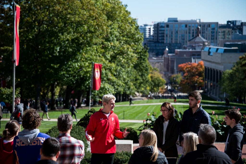 During an autumn tour, student guide Brandon Steer from Campus and Visitor Relations (CAVR), shows prospective students, family, and guests around campus at the top of Bascom Hill at the University of Wisconsin–Madison on Oct. 18, 2018. Visitors can see down State Street to the capitol building from the top of Bascom Hill.(Photo by Lauren Justice / UW–Madison)