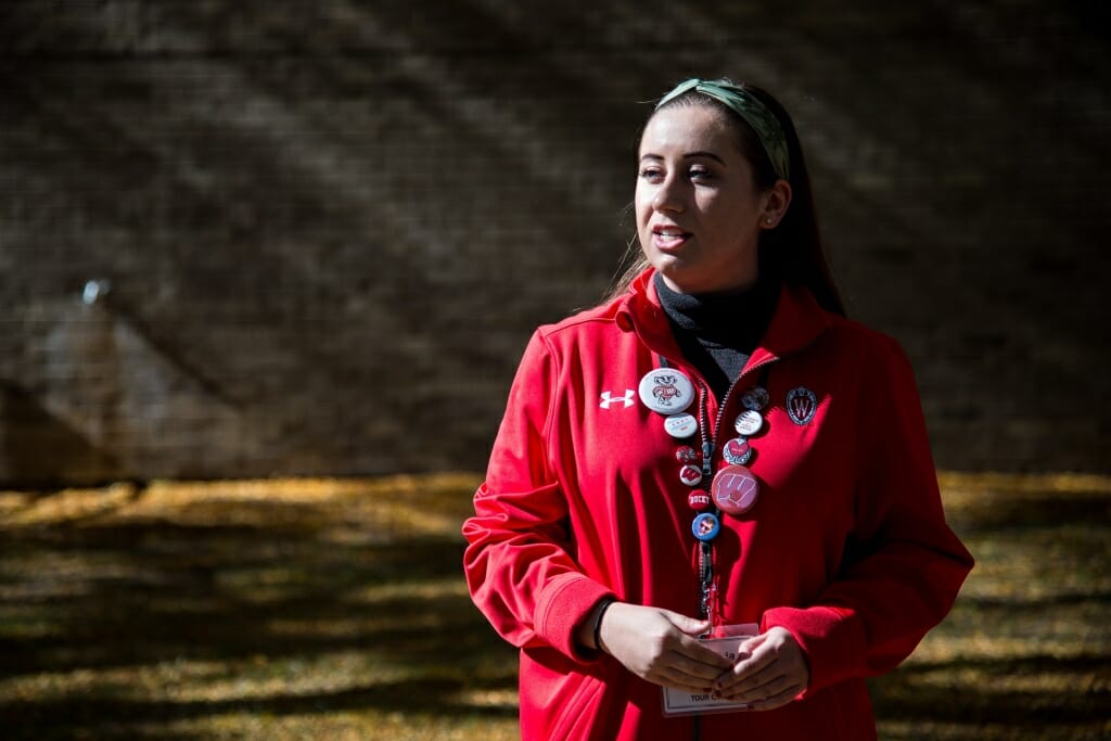 During an autumn tour, student guide Sophia Stephenson, from Campus and Visitor Relations (CAVR), shows prospective students and guests the University of Wisconsin–Madison campus on Oct. 18, 2018. (Photo by Lauren Justice / UW–Madison)