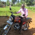 Photo: A man sits on a motorcycle.