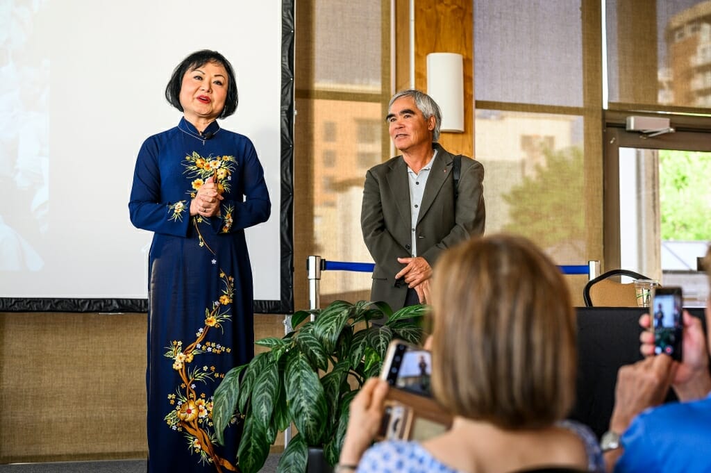 Photo: Kim Phuc and Nick Ut talk to the crowd.