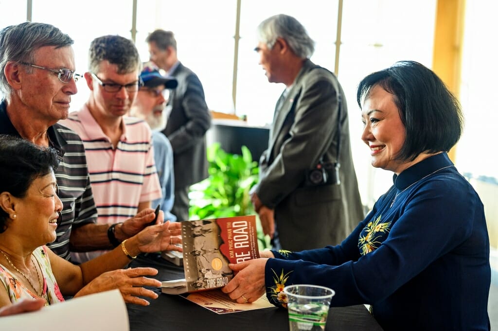 Photo: Kim Phuc talks with an audience member.