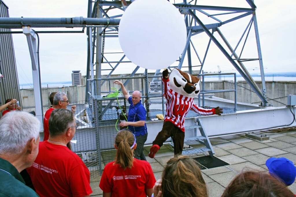 Bucky Badger showed up to help launch a weather balloon during a Grandparents University meteorology class, atop the Atmospheric, Oceanic and Space Sciences building.