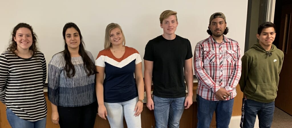 Photo: Group photo of interns standing in a row