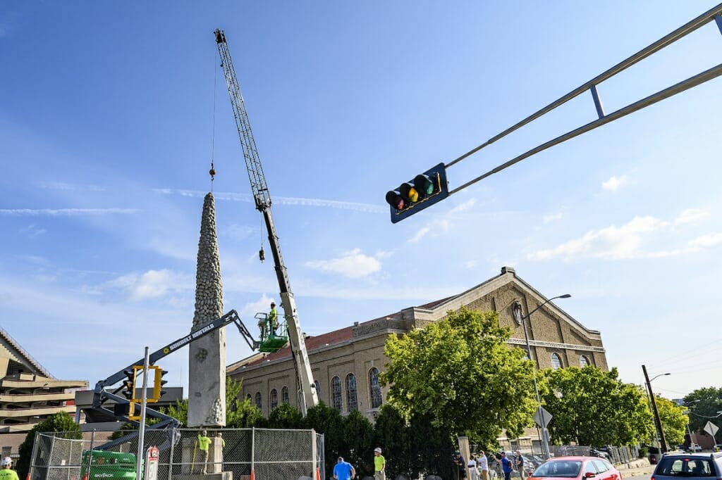 Photo: The Nails' Tails sculpture with a crane's wire attached to it in preparation for a move.