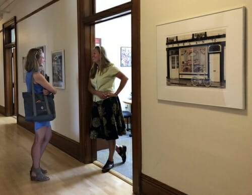 Photo: 2 people standing in a doorway