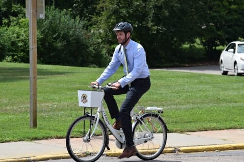 Photo: A man on a bike.