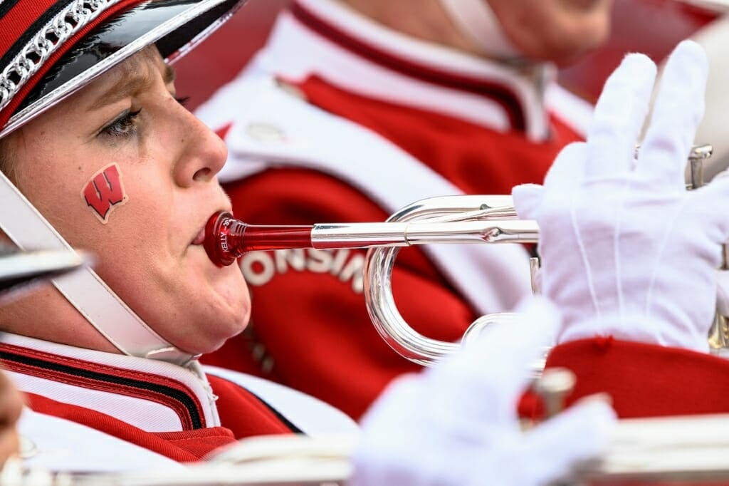 Photo: Band member with motion-W on cheek