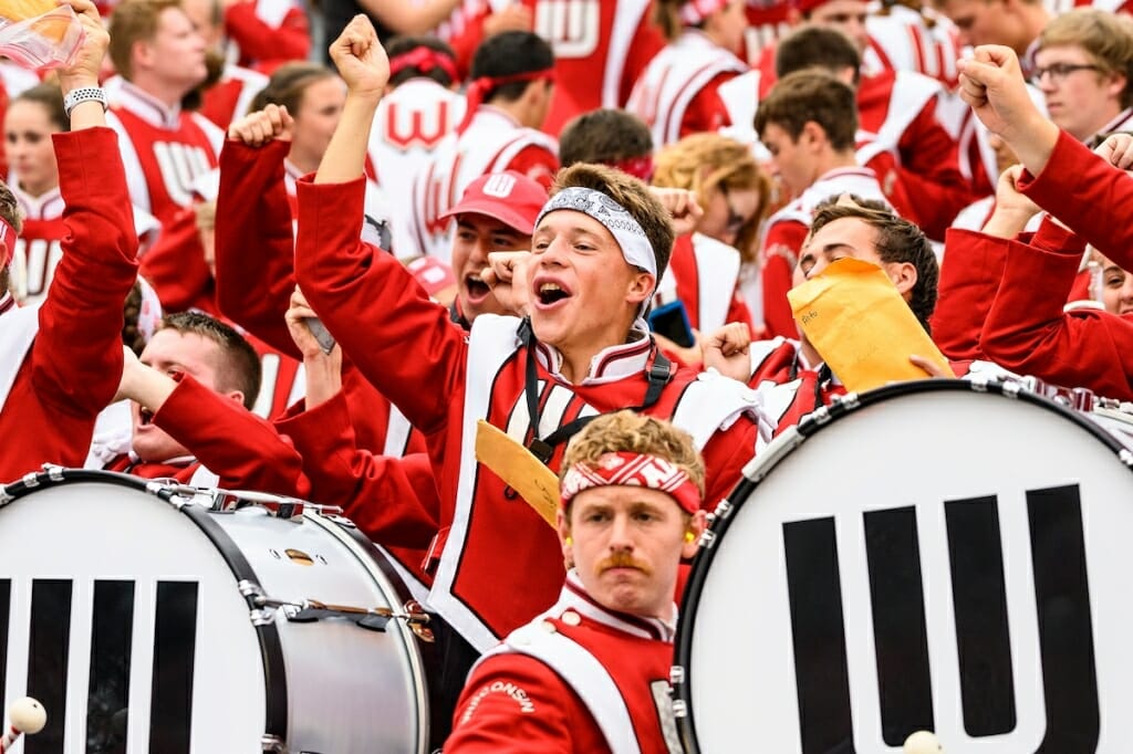 Photo: Band members cheering and pumping fists