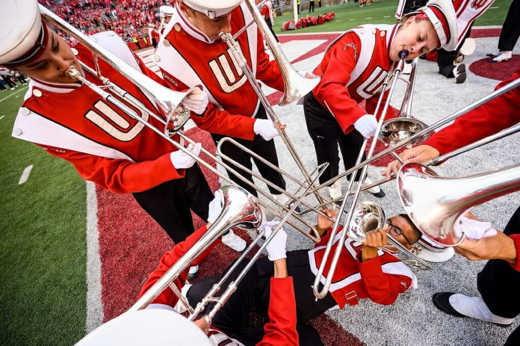 Photo: Band members with trombones intersecting