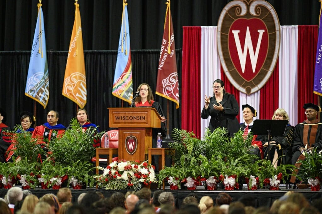 Photo: Boudnik speaking at podium