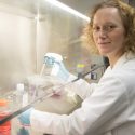 Photo: Portrait of Heidi Dvinge working at lab bench