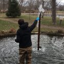 Photo: Man standing in pond