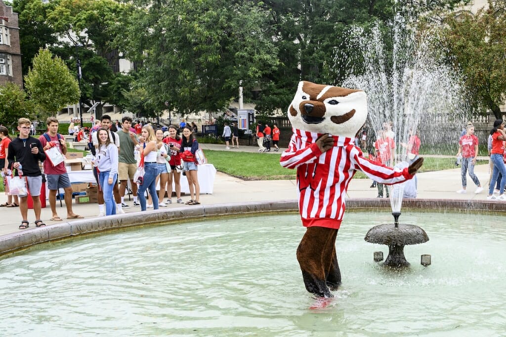 Photo: Bucky Badger wades in the Haggenah Fountain.