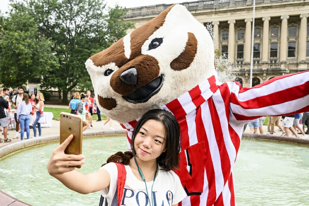 Photo: A woman takes a selfie with Bucky Badger.