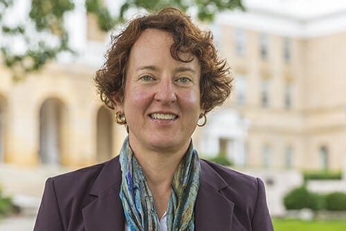 Photo: Portrait of Zaeske standing in front of Bascom Hall