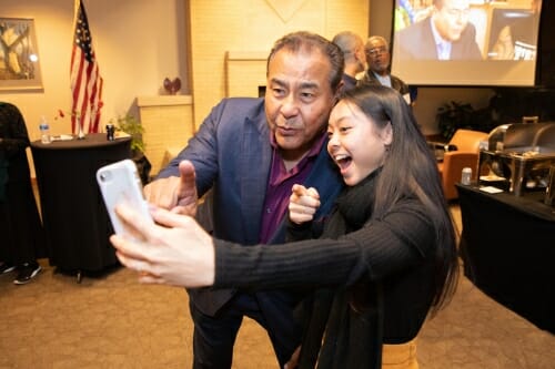 Photo: Two people pose for a selfie.