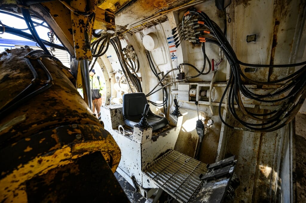 An operator sits here inside the tunnel bore head.