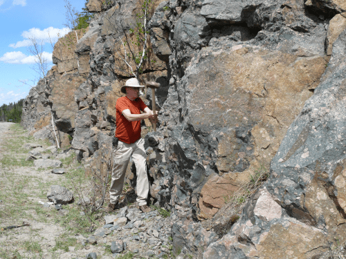 Photo: John Valley climbs on a rock formation.