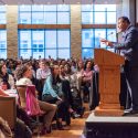 Photo: A man speaks to a crowd of people