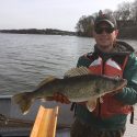 Alex Bentz, field technician at the the Wisconsin Department of Natural Resources holds a walleye. A new study by UW–Madison Center for Limnology graduate student Holly Embke shows that the state’s walleye fishery is being overharvested at a rate ten times higher than fishery managers anticipated. 