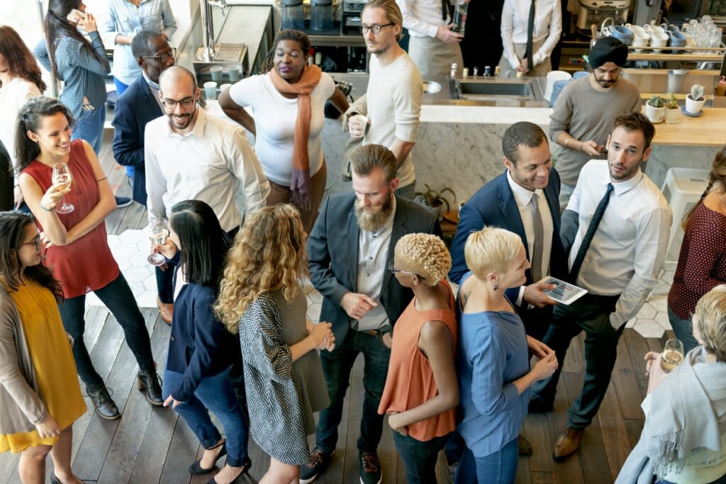 Photo: Group of people mingling at a party