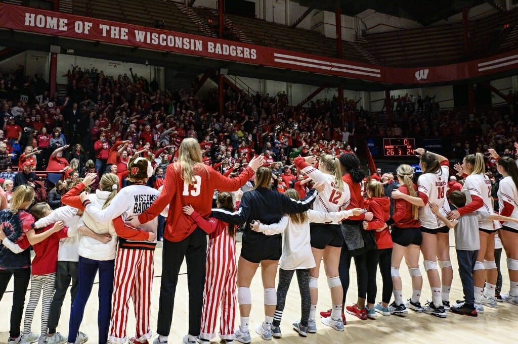 Photo: Members of the team sing Varsity with fans