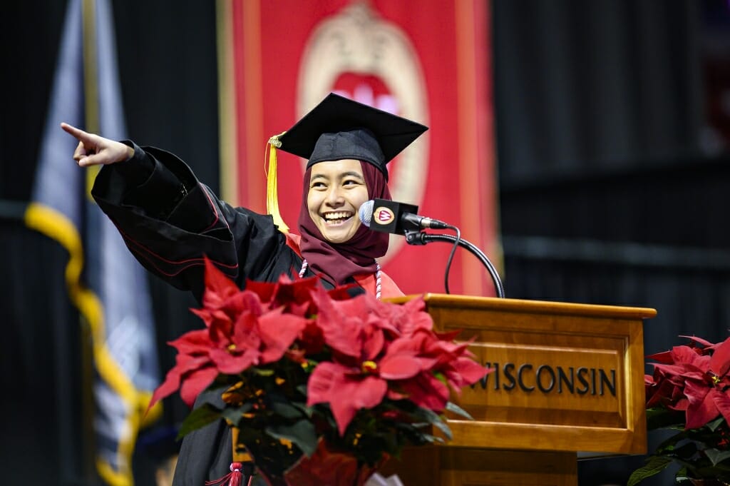 Photo of Lisa Kamal pointing toward the audience.