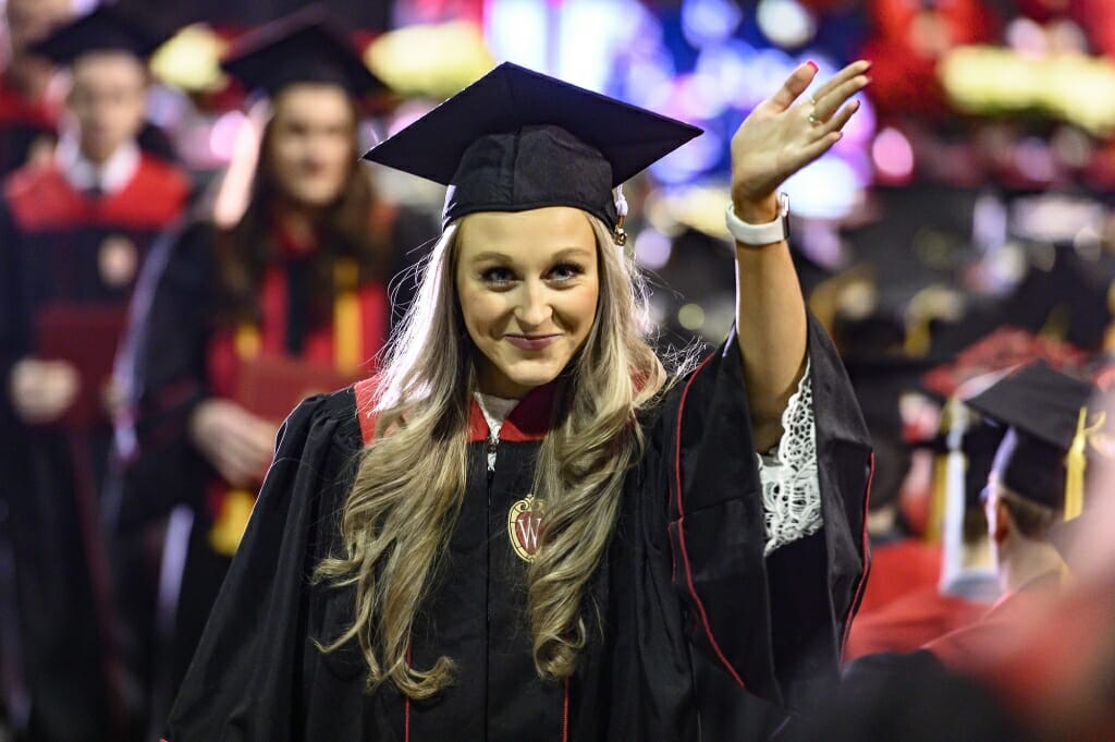 Photo of Mya Quick waving to her family in the audience.