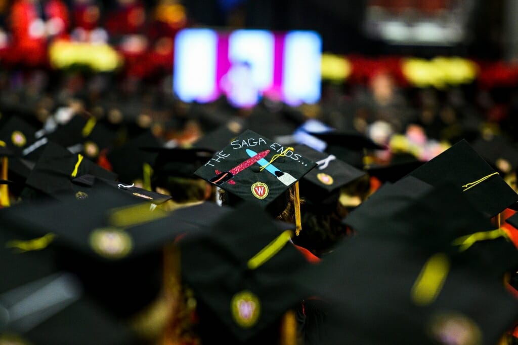 Photo of a mortarboard with two crossed lightsabers and the words "The saga ends."