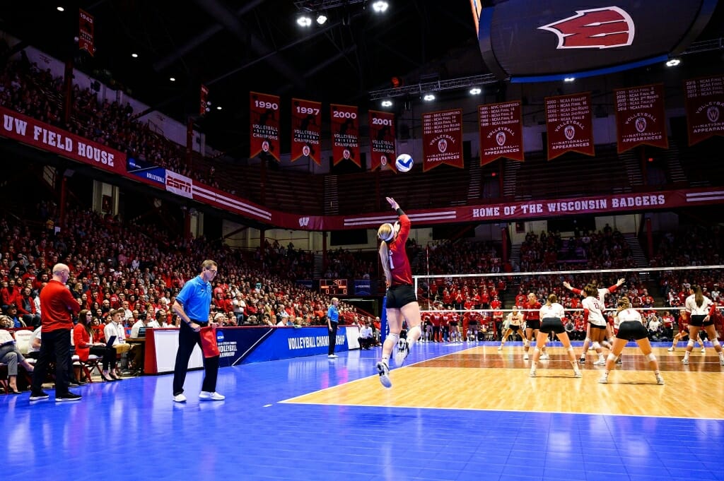 Photo: Wisconsin libero Tiffany Clark (17) serves the ball.