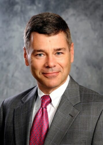 Photo: Studio portrait of Christopher Strang