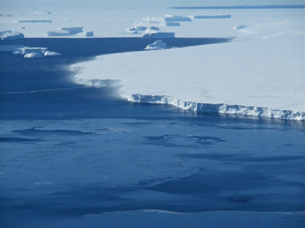 Photo: A big chunk of ice comes loose from more ice.