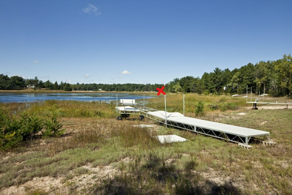 A lake's receding shoreline, with lots of dry beach.