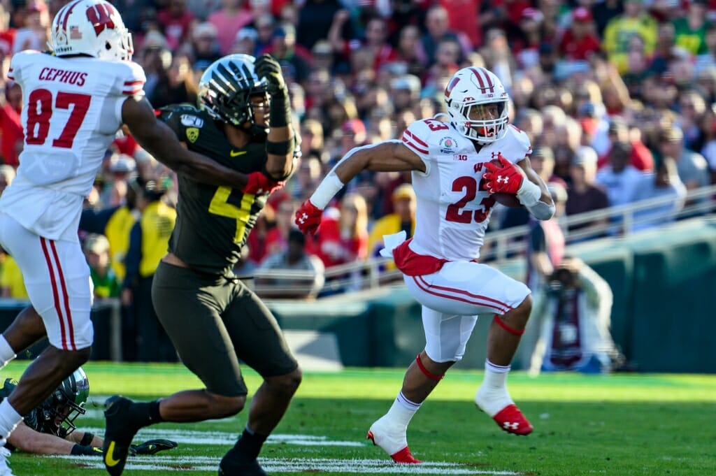 Wisconsin running back Jonathan Taylor runs for yardage as the Wisconsin Badgers take on the Oregon Ducks in first half of the 2020 Rose Bowl in Pasadena, California.