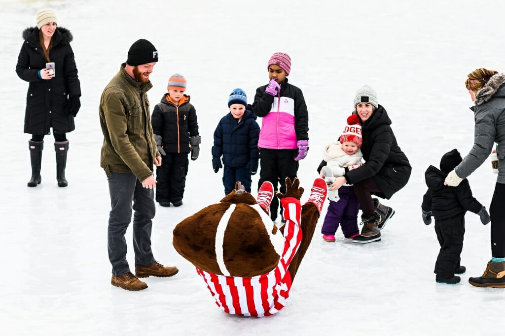 Bucky Badger slips and slides on the ice.