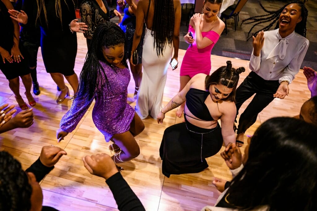 Two students dance on the dance floor.