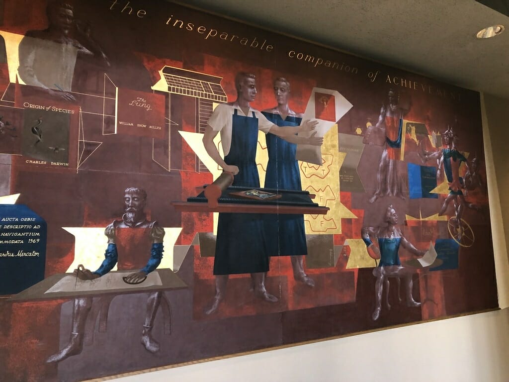 A mural with maroon, black and red shades.