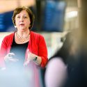 Kathleen Culver standing before students, gesturing with her hands