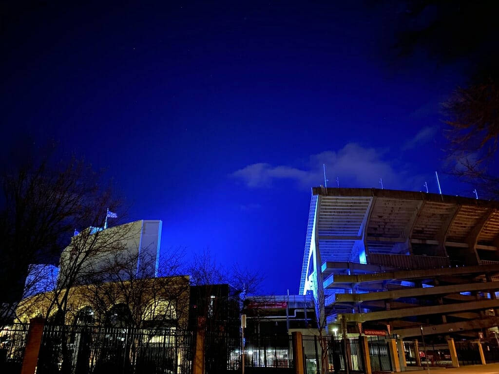 The blue light fills the space above Camp Randall Stadium.