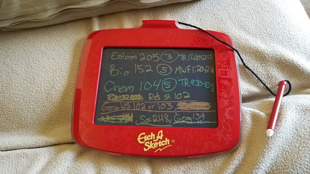 Class schedule written on an Etch A Sketch