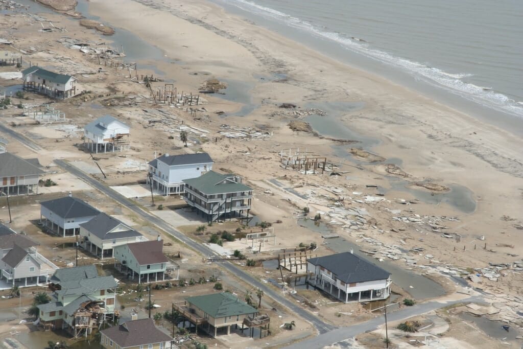 Aerial view of damaged buildings along coast