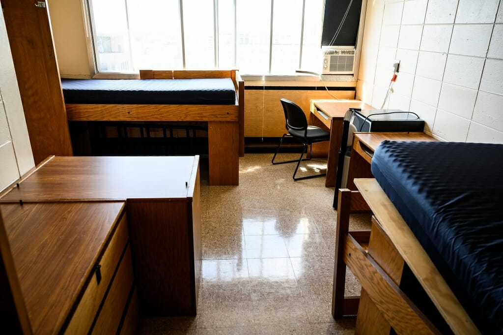 An empty residence hall room.