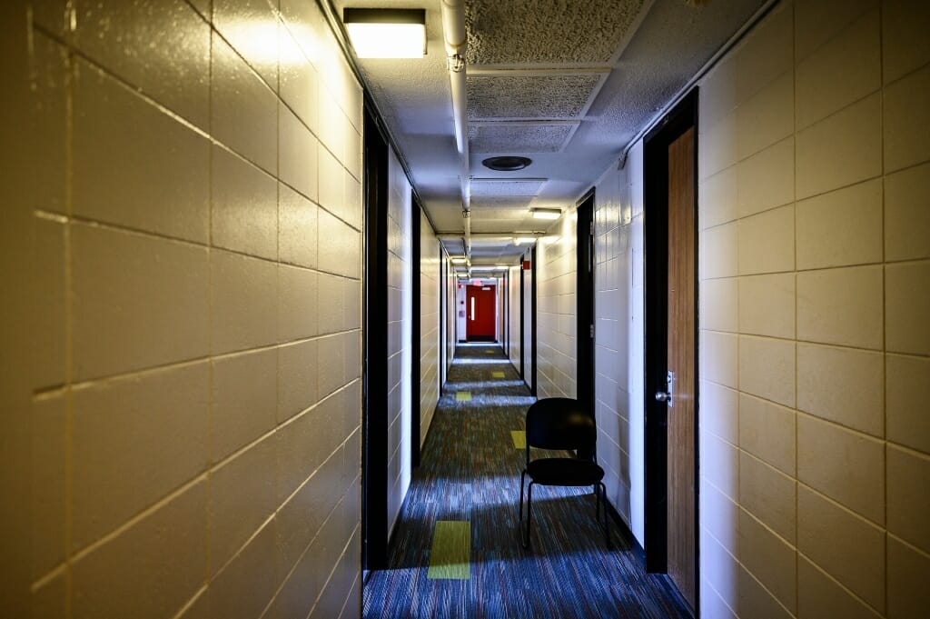 An empty hallway in a dorm.