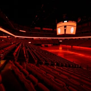 The interior of the Kohl Center bathed in red.