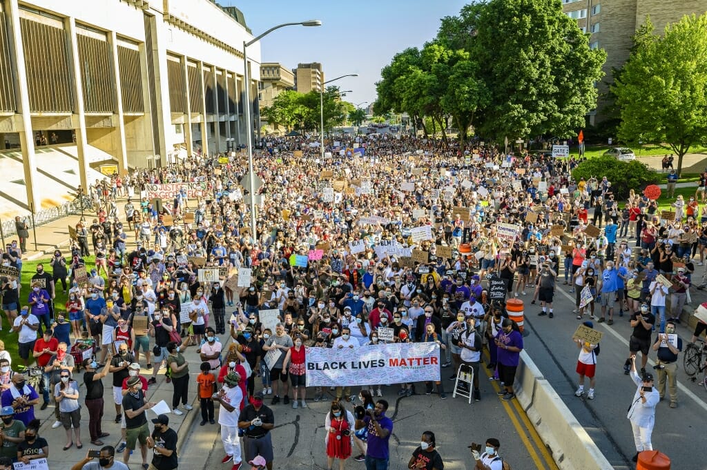 Protestors marching in street