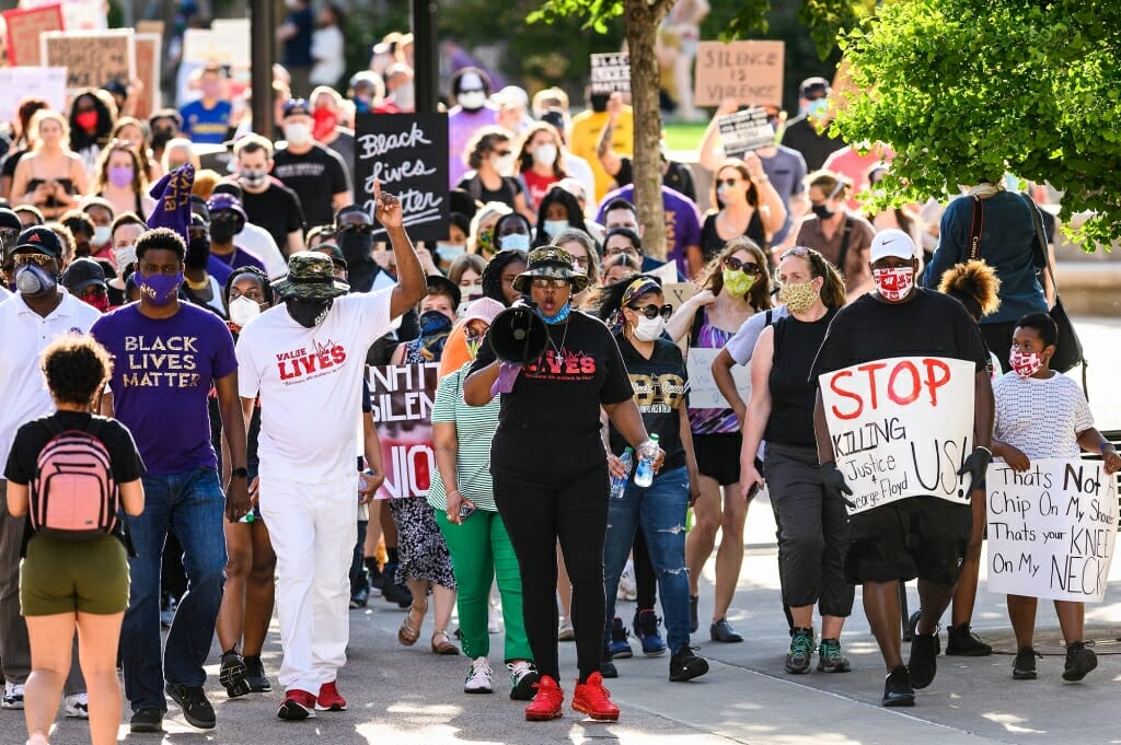 Protestors carrying signs