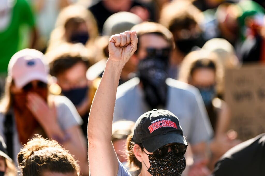 Marcher holding up fist