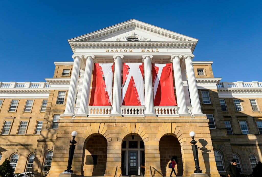 Bascom Hall's pillared front, covered in banners that form a W.