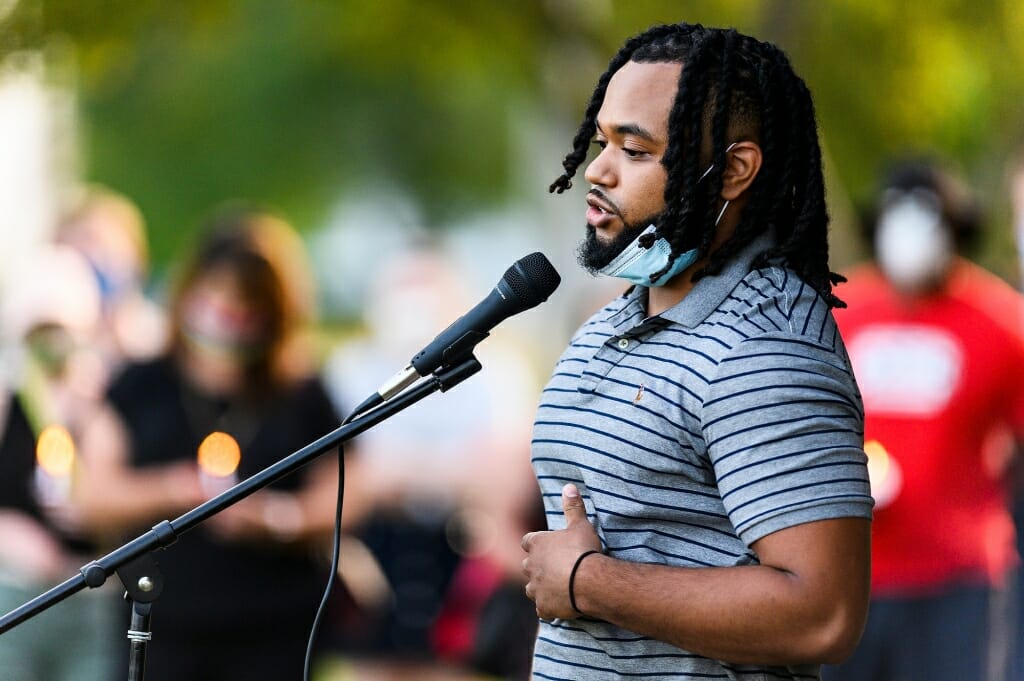 A man speaks into a microphone.